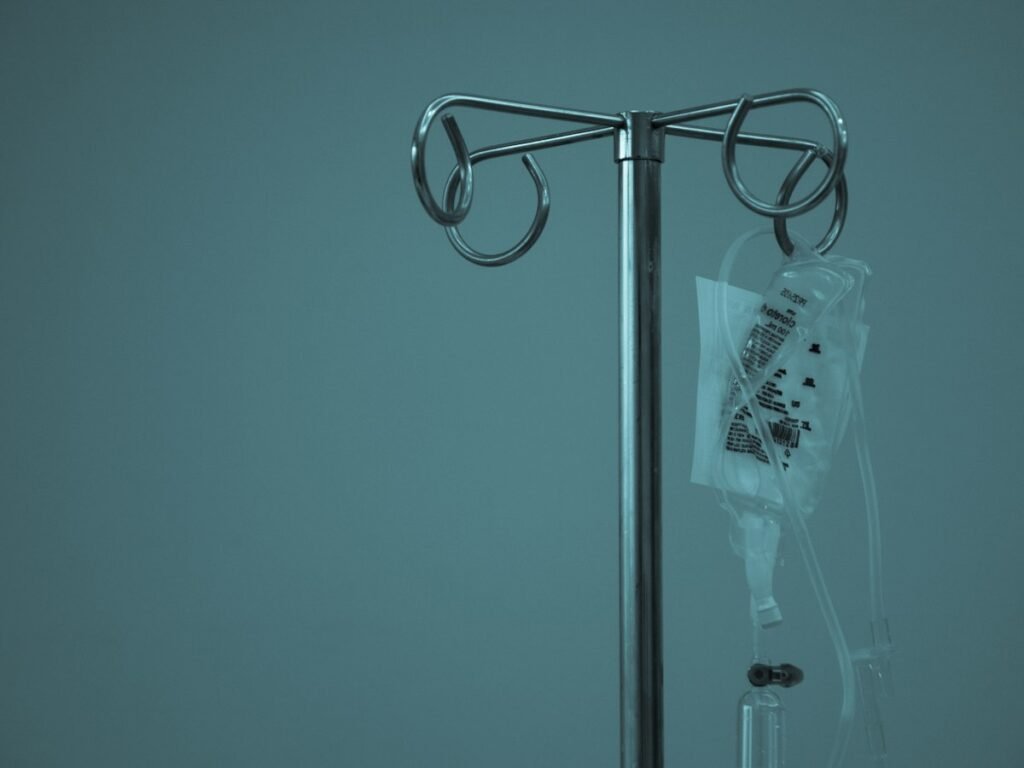 A hospital drip stand, representing recovery after discharge