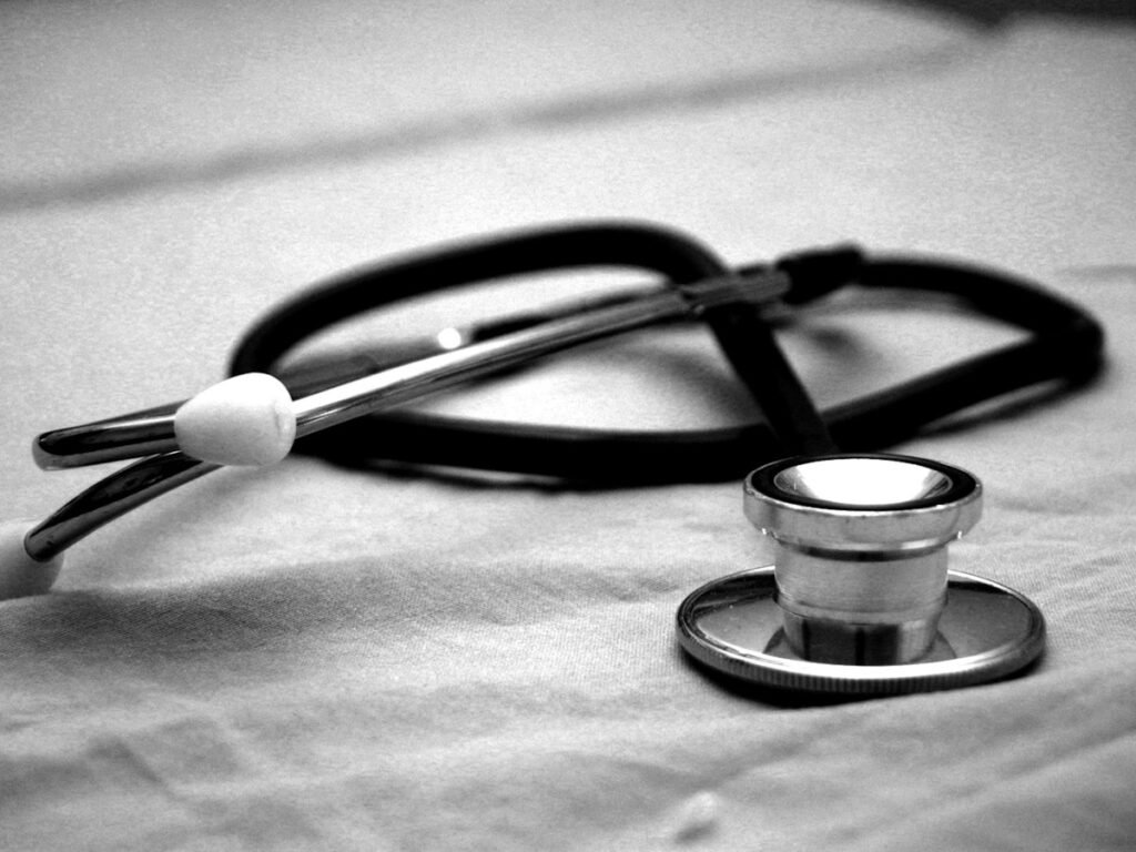 A stethoscope resting on a white surface